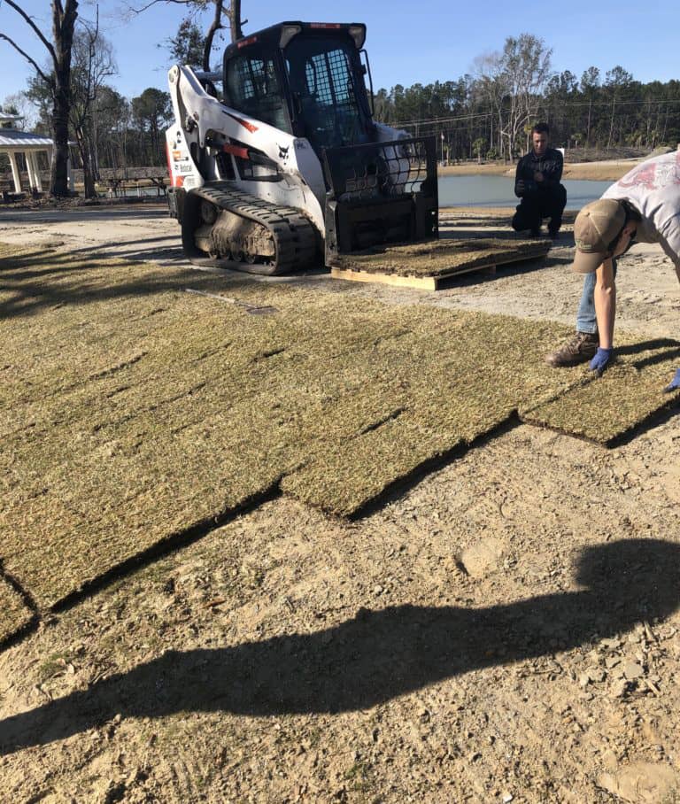 Men Laying Sod In Winter
