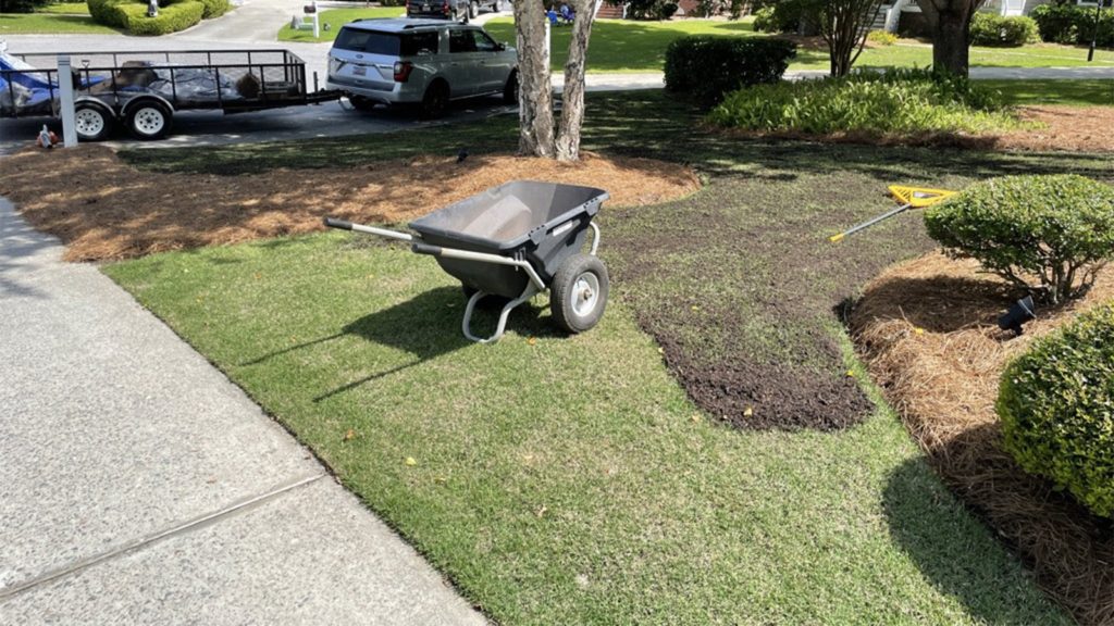 Top Dressing For Lawn Being Applied