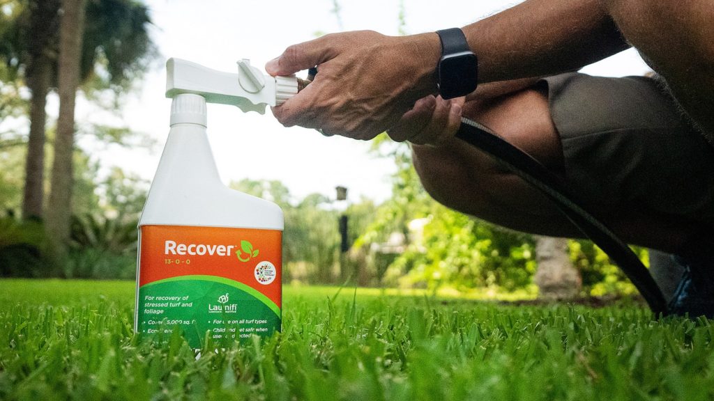 Lawnifi Recover Bottle Connecting To Hose On Grass Lawn